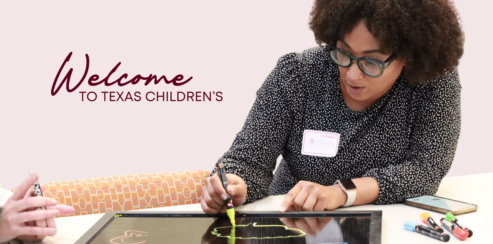 Texas Children's Hi participant writes in her orientation booklet. Text reads, Welcome to Texas Children's