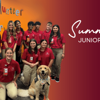 A group of Summer Junior Program students pose with a facility dog at Texas Children's The Woodlands.