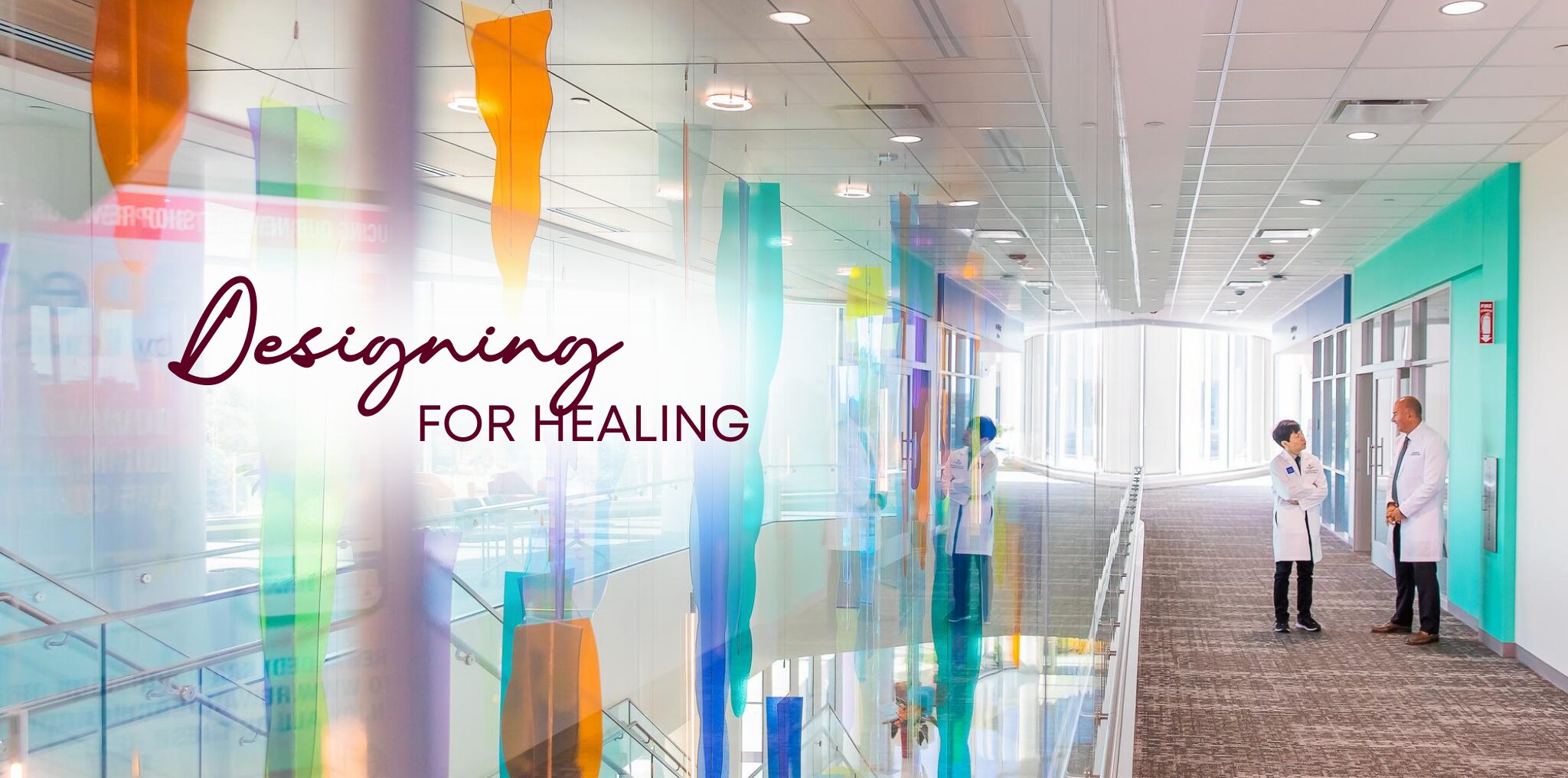 Glass artwork in a corridor of the Texas Children's North Austin Campus with text that reads Designing for Healing.