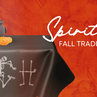 A decorative cauldron and pumpkins atop a table with skeletons spelling TCH. Text reads, Spirited fall traditions.