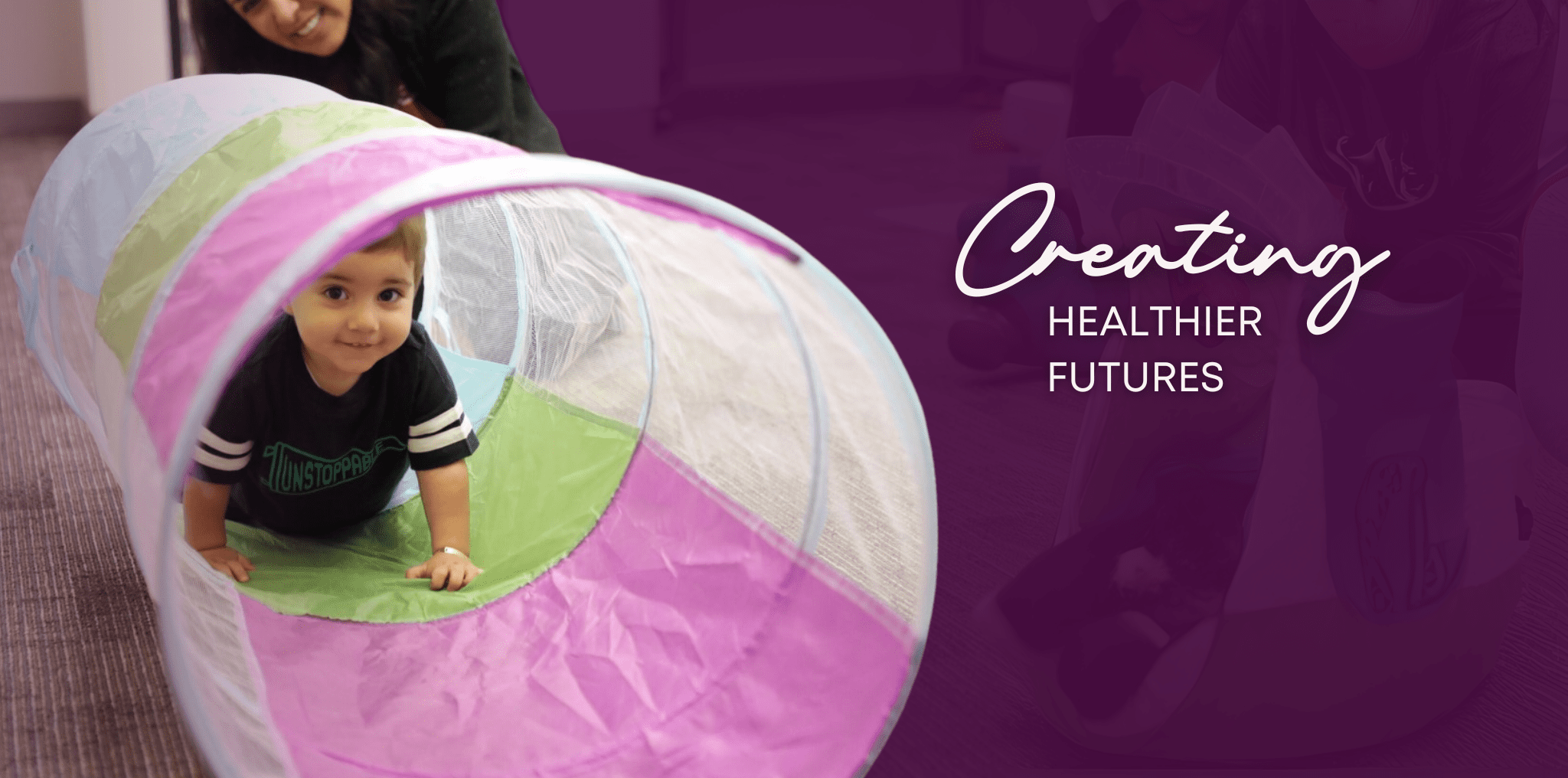 A young participant in upSTART Community Programs crawls through a playroom tunnel, smiling. Text reads: Creating Healthier Futures